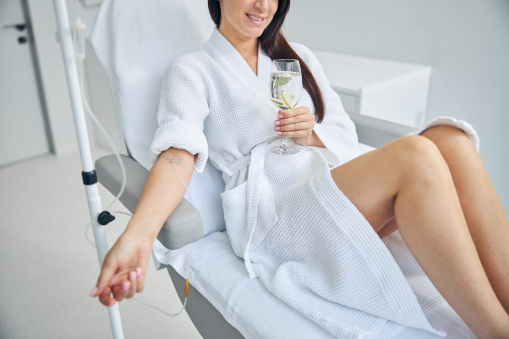 Physician preparing an IV therapy drip
