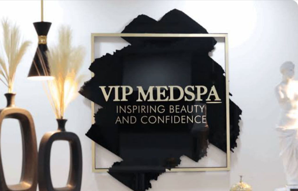 Gold VIP MedSpa sign reading Inspiring Beauty and Confidence
